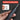 A hand holds a black magnetic precision screwdriver against a dark gray background with a red banner reading 'MAGNETIC PRECISION'