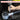 Hand using a tool with text about hardened steel construction