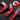 Red and black utility knives on a dark background with close-up inset.