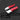 Two red utility knives on a dark background with features highlighted.