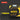 Yellow and black laser measure with digital display on a dark background