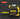 Yellow and black laser measure with digital display on a dark background
