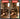 Before and after comparison of a person using a laser level on wooden flooring.