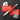 Red screwdriver with bits on a black background with text about its convenience.