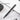 Black safety snap-off knife on a marble surface with text indicating the feature.