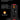 Black and red electronic device with audio broadcast features on a black background