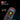Digital level and angle sensor with red and black design on a dark background
