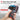 Hand holding a digital measuring device with screen displaying measurements, set against a blurred indoor background.