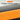 Product with an orange strip and text about installing a magnet, on a gray background.