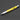 Yellow pen with a ruler on a dark background