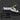 Multitool with knife blade, screwdriver, and pliers on a dark background
