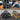 Collage of a mechanic working on a car, an electrician using tools, and a tool storage bag with tools.