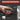 A hand holding a black dual-mode screwdriver against a dark background, with callout labels pointing out features such as electric and manual modes, 3-speed torque adjustment, Type-C charging, 2000 mAh battery capacity, LED lighting, and a flexible shaft.