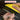 A close-up of a hand holding a yellow and black abrasive polishing tool against a dark background, with text overlays reading 'WORK SMARTER' and 'IDEAL TOOL FOR POLISHING TILE, CERAMIC, GLASS, MARBLE, GRANITE, STONE, AND OTHER HARD SURFACES'.