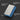 Blue sanding block with text on its uses on a dark background