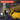 A promotional graphic with the heading 'CHARACTERISTICS' over a photo of a person wearing yellow gloves and using a diamond polishing pad attachment on a metal surface, with a list of product features on a dark translucent panel.