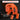 Orange tool bit holder with text about compatibility on a dark background
