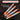 Set of tools with pointed and flat tips on a dark background, featuring text 'One Tool. Two Heads'.