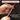 Hand holding a spring-loaded impact tool with text about accurate force delivery.