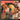 Person wearing an orange tool belt with tools, holding a drill, next to a dog.