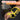 Hand wearing a yellow and black wrist support with text about its features.