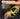 Hand wearing a yellow and black wrist support with text about its features.
