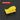 A bright yellow rectangular foam-like sponge or pad shown on a dark gray background with subtle concentric circular lines. A red label at top left reads “SQUARE 2.