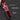 Red tool belt with tools and features highlighted on a dark background