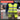 Person wearing a high-visibility safety vest in an industrial setting with text highlighting features.