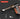 Handheld vacuum cleaner with attachments on a dark background