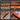 Orange tool with black blade used for brick and paver profiling, multi-pipe tracing, round objects bypass, and door frame duplication.