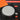 Precision locking dial with unlock and lock labels on a black and orange background