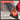 A promotional graphic for a sanding kit showing an orange and black angle grinder in use with a red work glove, over a light wood surface. A large semi-transparent dark gray text box on the left lists characteristics: complete 65-piece value pack, dual-design sanding kit, effortless hook and loop backing, industrial-grade chrome and PU backing, and premium material construction.