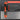 Orange and black tool with features listed on a gray background