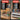Before and after comparison of a workshop setup with tools on a table and organized in a cabinet.