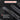 Knife with text indicating precise results for cutting various materials on a dark background