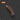 Retractable knife with orange handle on a dark background