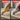 Before and after comparison of a person using a yellow and black knife to cut cardboard.