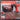 Red and black tool set with drill and toolbox on a gray background, featuring text about tool set characteristics.