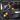 Tool belt with various pockets and features on a gray background