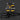 Black and yellow tool vest with multiple pockets on a dark background
