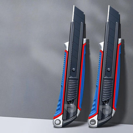 Two blue and black utility knives with red accents on a gray background