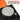 Close-up of a mechanical component with text on an orange and black background