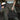 Person holding a tactical tool black bag with padded handles, showing a close-up of the handle texture.