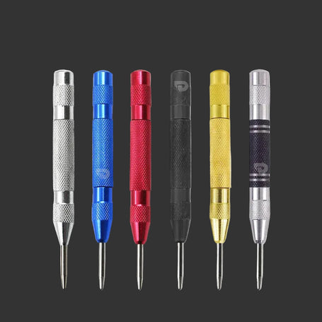 Set of six metal tools with different colored handles on a dark background