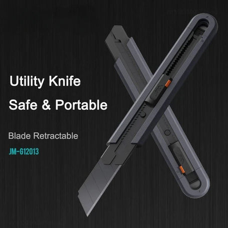 Utility knife with retractable blade on a dark background
