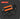 Mechanical combination set with orange and black components on a dark background
