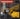 A promotional graphic with the heading 'CHARACTERISTICS' over a photo of a person wearing yellow gloves and using a diamond polishing pad attachment on a metal surface, with a list of product features on a dark translucent panel.