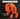 Orange tool bit holder with text about compatibility on a dark background