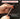 Hand holding a spring-loaded impact tool with text about accurate force delivery.